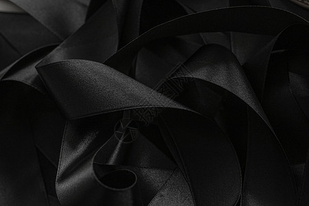 黑丝带作为背景 抽象和奢侈的品牌阴影反射奢华桌面丝带丝绸皮革工作室黑色黑与白背景图片