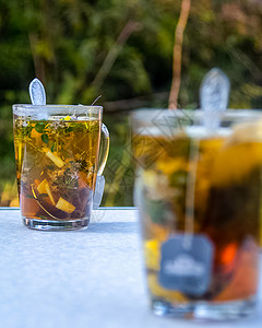 果味茶透明杯子加茶 包装泡茶 草药茶 草药茶沸腾水果早餐饮料茶包酿造玻璃果味芳香香气背景