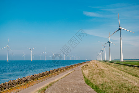海上风车公园 有暴云和蓝天 海中风车公园发电机植物场地技术活力农场蓝色生态力量涡轮背景图片