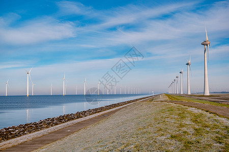 弗莱外海风车公园 有暴云和蓝天 还有海洋中的风车公园农场场地生态天空蓝色环境植物涡轮机涡轮力量背景