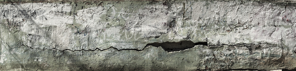 脱皮墙 混凝土墙的全景图 上面有旧的开裂剥落油漆 风化粗糙的油漆表面有裂缝和剥落的图案 设计背景的宽全景纹理背景图片
