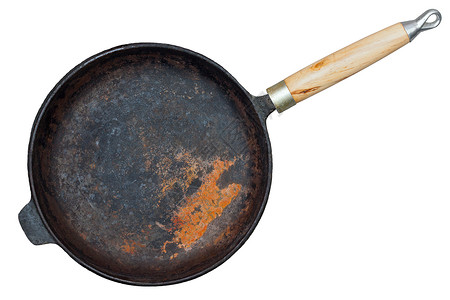 在白色背景上隔离的锈铁铸铁锅油炸用具投掷食物小路工具乡村炊具烹饪厨房背景图片