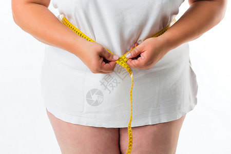 女人用胶带测量腰部重量皮肤尺寸营养躯干损失女孩成人臀围女性背景图片