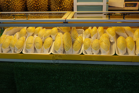 在市场上销售的包件中产黄果 在泰国作为季节性水果包装中的黄当量核糖营养国王榴莲生食农场美食健康饮食情调食物异国甜点高清图片素材