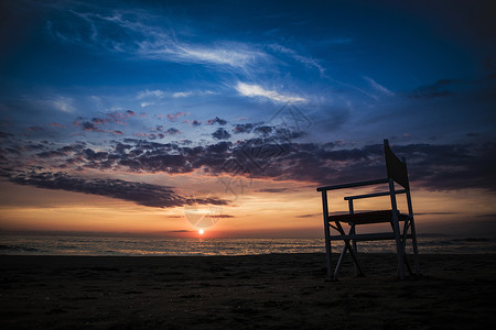 冬季海季节性旅行日落椅子地平线太阳蓝色天空季节阳光背景图片