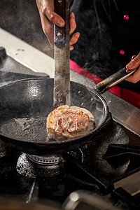 猪肉牛排牛肉厨房餐厅食物鱼片平底锅烹饪午餐油炸猪肉背景图片