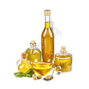 旧瓶装橄榄油勺子收成黄色瓶子食物玻璃树叶油壶白色作品背景图片