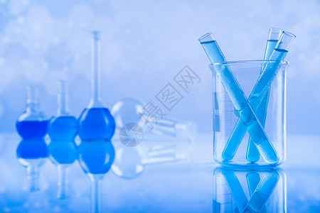 实验室水箱 显微镜 蓝底器皿实验生物学技术液体化学烧瓶反射药品测试背景图片