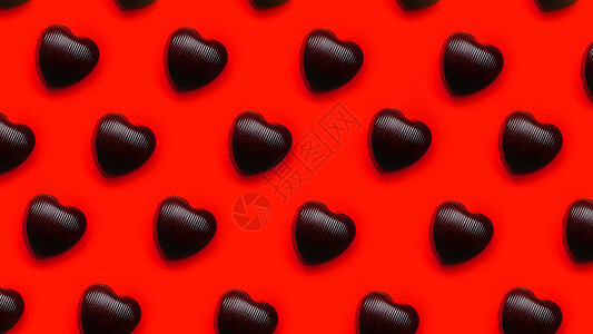 巧克力心形巧克力在红色背景上一排连续盒子糕点饼干卡片甜点美食生日庆典礼物小吃背景图片