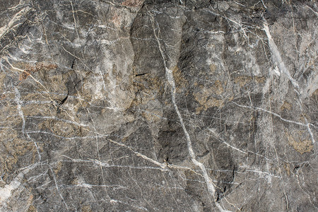 作为背景纹理的岩石或石头表面墙纸材料土壤宏观石灰石地面矿物灰色花岗岩石板多岩石的高清图片素材