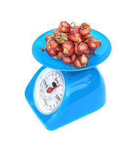 厨房秤和洋葱蔬菜用具平衡机器重量香料食物厨房灯泡乐器背景图片
