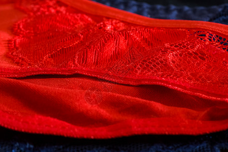 蓝色和红红色女人的蕾丝内裤白色衣服女性棉布配饰服装裤子纺织品织物背景图片