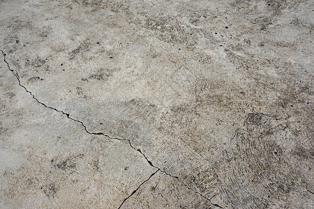 水泥地不是灰色的 有裂缝 将水泥分成大小不等的 3 份 纹理或背景背景图片