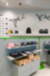 服装店的抽象模糊商品销售部门衣服展示零售产品精品市场白色中心高清图片素材