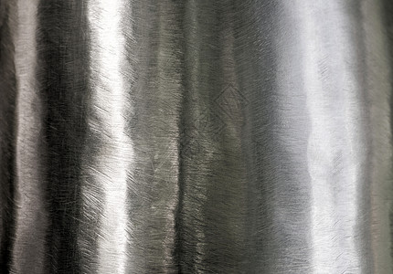 闪亮的表面和不锈钢上的划痕材料白色金属曲线拉丝圆形工业背景图片