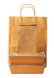 白色背景的棕色手工艺纸纸袋包装模板午餐产品零售广告生态小袋环境小样店铺销售背景图片