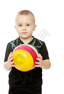 那个小男孩手里拿着球的小男孩孩子运动白色足球青年微笑童年游戏男性幸福背景图片