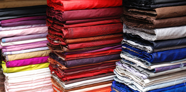 织布样品样本纺织品风格羊毛装饰小地毯生产橙子商品仓库收藏背景图片