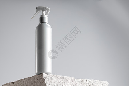 灰煤渣块上的化身罐子石头治疗护发素温泉小样化妆品包装产品瓶子广告背景图片