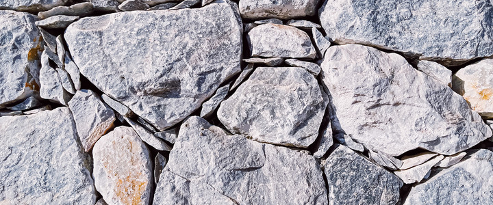 天然石材墙石材质感与外观设计理念 石墙由天然岩石制成作为建筑表面背景装修奢华装饰边界绝缘大理石卵石房地产地板石头背景