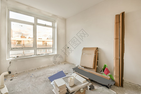 一个宽敞的房间正在翻修中玻璃建筑材料加热器窗户休息室天花板居住建筑地面建筑学背景图片