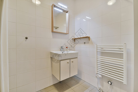 浴室墙背景浴室室内用白色瓷砖和水槽完成房子材料陶瓷住宅洗手间龙头大理石卫生卫生间装饰背景