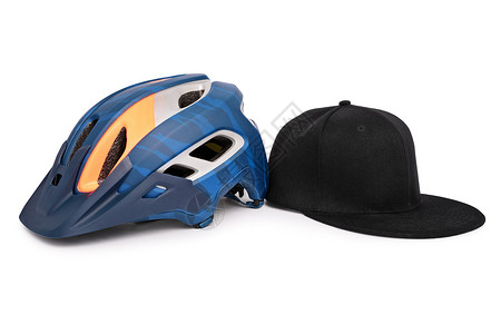 自行车头盔和棒球快击帽并排高清图片