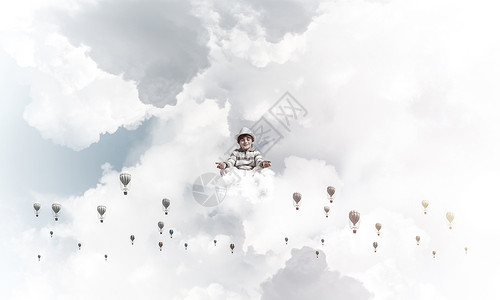 小男孩有意识地记着精神活力自由男生飞行冥想气球专注幸福瑜伽背景图片