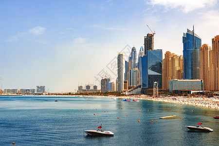 迪拜Jumeirah海滩居民点海滩全景假期长廊晴天旅游民众摩天大楼码头观光旅行天际城市高清图片素材