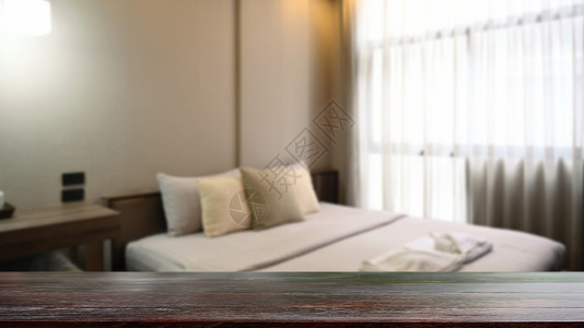 卧室桌面空木板桌和模糊的卧室背景 用于显示或补装您的产品背景