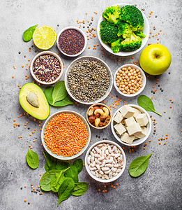 Vegen蛋白来源谷物饮食桌子坚果种子蔬菜产品大豆菠菜植物橙子高清图片素材