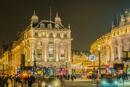 皮卡迪利马戏团夜景联合王国伦敦圣诞市场建筑霓虹灯背景图片