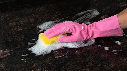 海绵泡沫带有海绵和泡沫的橡胶手套冲洗表面背景