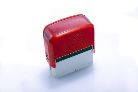 红色 办公室 自动 橡胶印章 白色邮票反射墨水背景图片