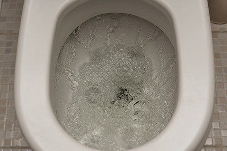 冲厕所 厕所 冲水 特写白色漩涡卫生浴室潮红涡流飞溅卫生间液体打扫背景图片