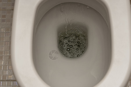 冲厕所 厕所 冲水 特写涡流潮红液体卫生间白色飞溅漩涡卫生浴室打扫背景图片