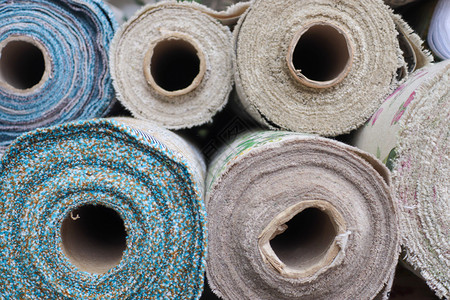 布殊的小册子在织物市场发现的不同颜色的布布和布料样本奢华装潢麻布材料床单艺术皮革墙纸下脚料质量背景