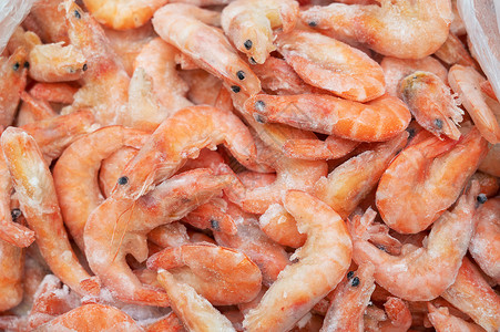鱼市冰箱里的冷冻虾营养餐厅贝类团体烹饪市场店铺销售食物橙子背景图片
