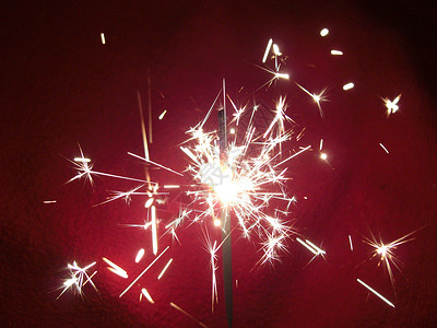 红色烟火特效闪光灯庆典派对周年星星焰火乐趣火花程序季节性耀斑背景