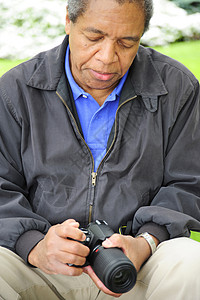摄影师黑色男性相片相机男人背景图片