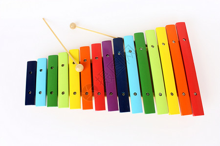 色彩多彩的 X伊耳语笔记孩子意义彩虹教育乐器噪音幼儿园音乐玩具背景图片