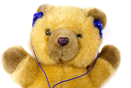 泰迪熊耳机玩具童年音乐婴儿孩子背景图片