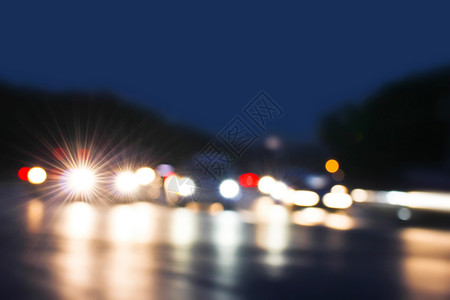 交通阻塞夜间交通 失去焦点运动背景闪光圆圈城市夜生活阻塞汽车街道反射背景