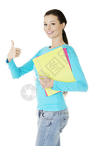 年轻女学生 看管好学校工作室身体牛仔裤快乐青年女士学生幸福手势背景图片