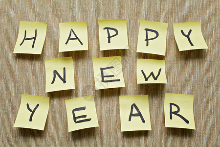 新年贺词张贴在贴纸上 祝新年快乐背景