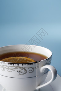 茶液体个性飞碟白色文化商品工作室香味陶瓷圆形背景图片