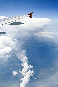 云翅膀航空亮度飞机预报照片蓝色暴风云风暴天气背景图片