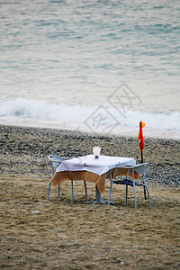 晚饭假期椅子海滩海洋行业餐饮木板沙滩断路器背景图片