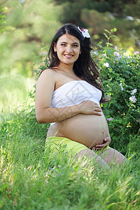 怀孕妇女福利父母诞生母性母亲快乐女士成人微笑花朵夏天高清图片素材