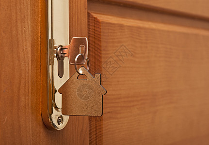 锁上有房屋图标的密钥内部的高清图片素材